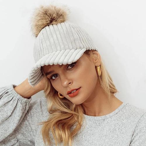 Model wearing light grey Impressive Women Pom-Pom Cap