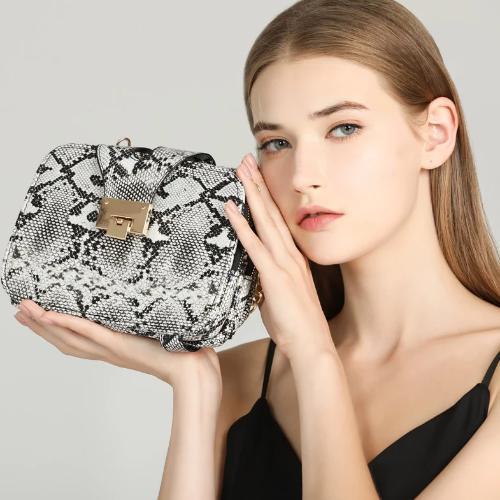 black, grey and white snakeskin bag