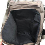 Rear hidden backpack compartment with zipper