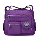 Purple crossbody travel bag water bottle holder