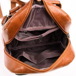 Leather backpack with zipper interior compartment