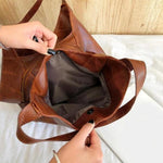 Multipocket brown leather bag
