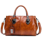 Brown leather handbag with triple compartment