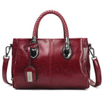 Red leather handbag with triple compartment