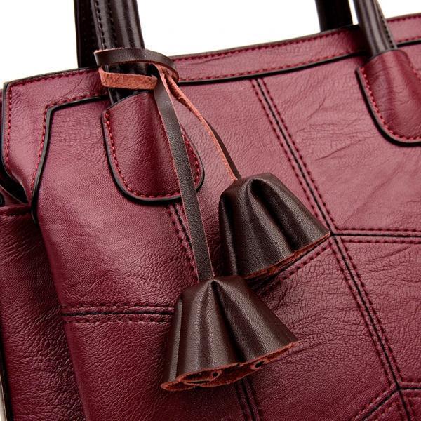 Leather handbag with tassels