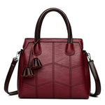 Red leather cross body handbags with top handles