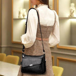 Black leather bag with large front pocket