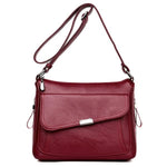 Red leather crossbody bag with large front pocket