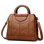 Brown leather crossbody purse with lots of compartments