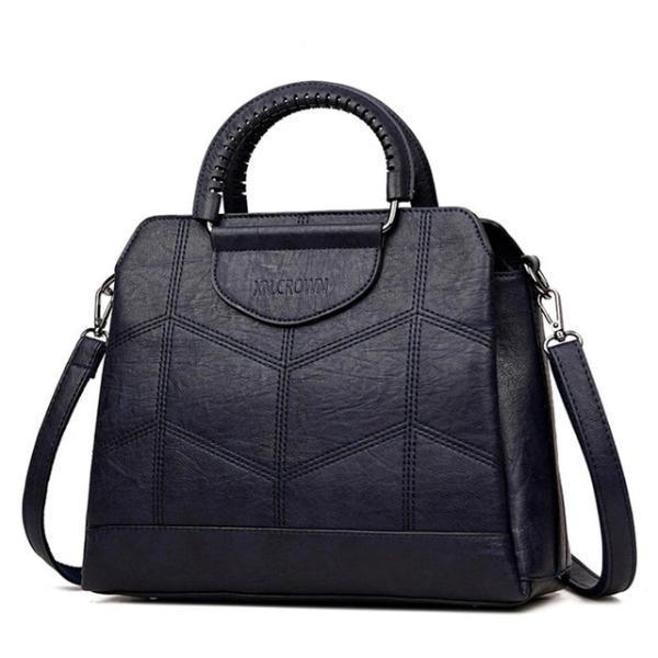 Blue leather crossbody purse with lots of compartments
