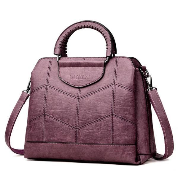Purple leather crossbody purse with lots of compartments