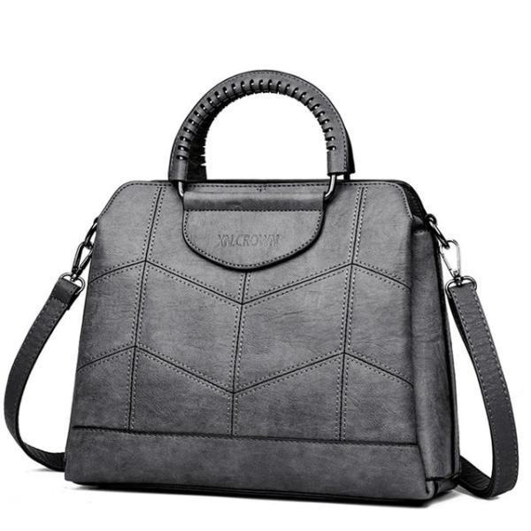 Gray leather crossbody purse with lots of compartments