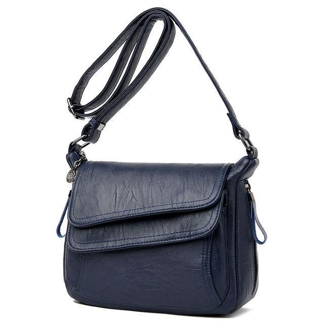 Blue leather crossbody bag with lots of pockets