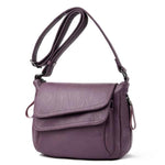 Purple leather crossbody bag with lots of pockets
