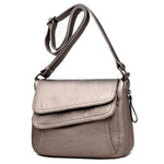 Bronze leather crossbody bag with lots of pockets