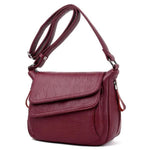 Red leather crossbody bag with lots of pockets