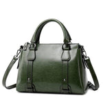 Green leather crossbody purse with handles