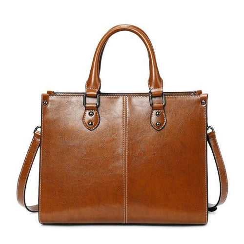 Brown leather cross body handbags with top handles