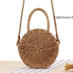 Brown straw crossbody bag with shoulder strap