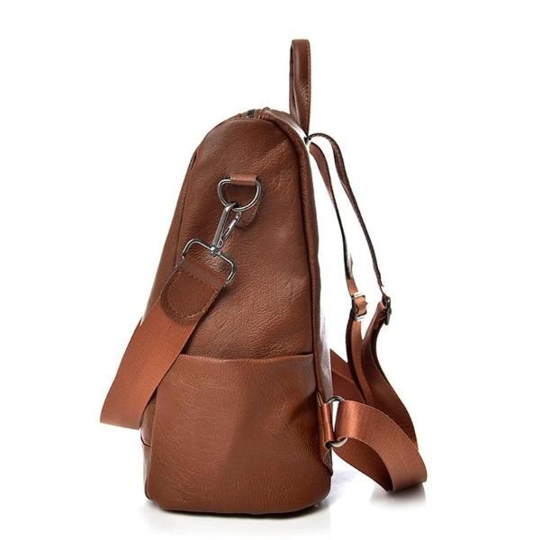 Brown leather backpack with side bottle compartement