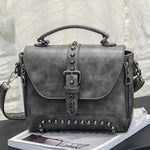 Gray Vintage handbag with rivets and spikes
