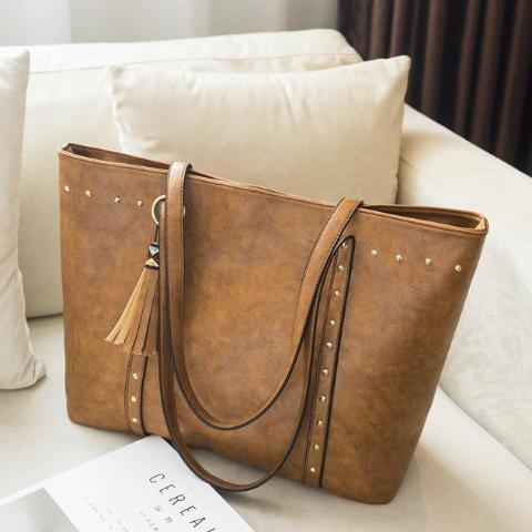 Brown leather tote with rivets