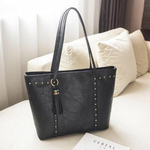 Black leather tote bag with pockets and zipper