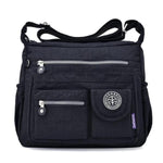 Black crossbody travel bag water bottle holder