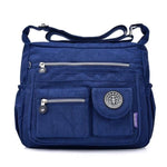 Dark blue crossbody travel bag water bottle holder