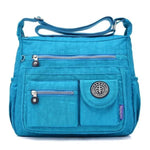 Light blue crossbody travel bag water bottle holder