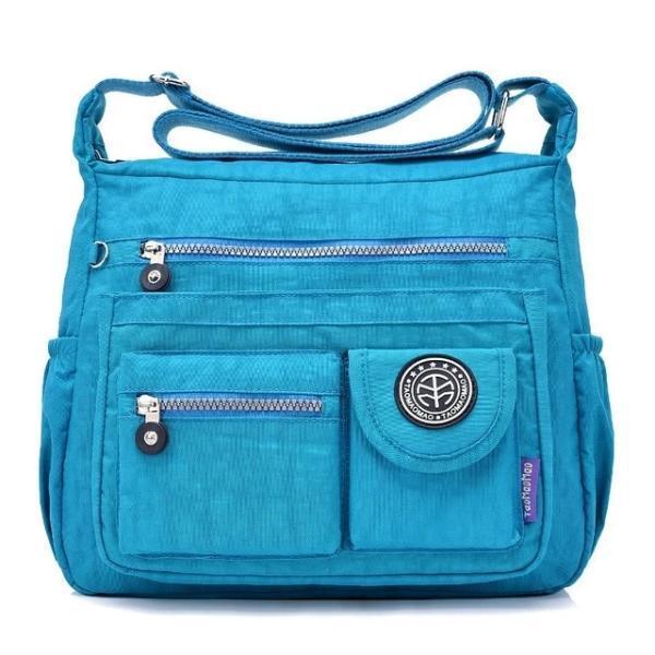 Light blue crossbody travel bag water bottle holder