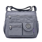 Grey crossbody travel bag water bottle holder