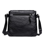 Small black handbag with back zipper pocket