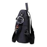 Black nylon backpack with side pocket