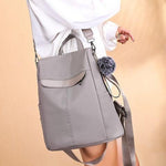 Gray backpack with shoulder strap for women