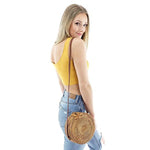 round rattan bag with leather strap