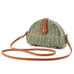 Green straw crossbody bag with leather crossbody strap